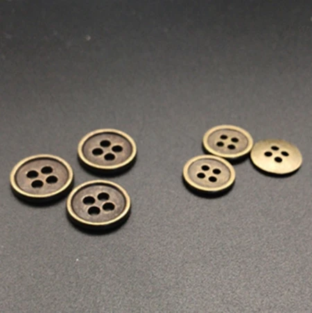 Wholesale of four-hole metal concave seam buttons for fashionable trench coats, down jackets, clothing accessories and buttons from the manufacturer Wholesale of four-hole metal concave seam buttons for fashionable trench coats, down jackets, clothing accessories and buttons from the manufacturer